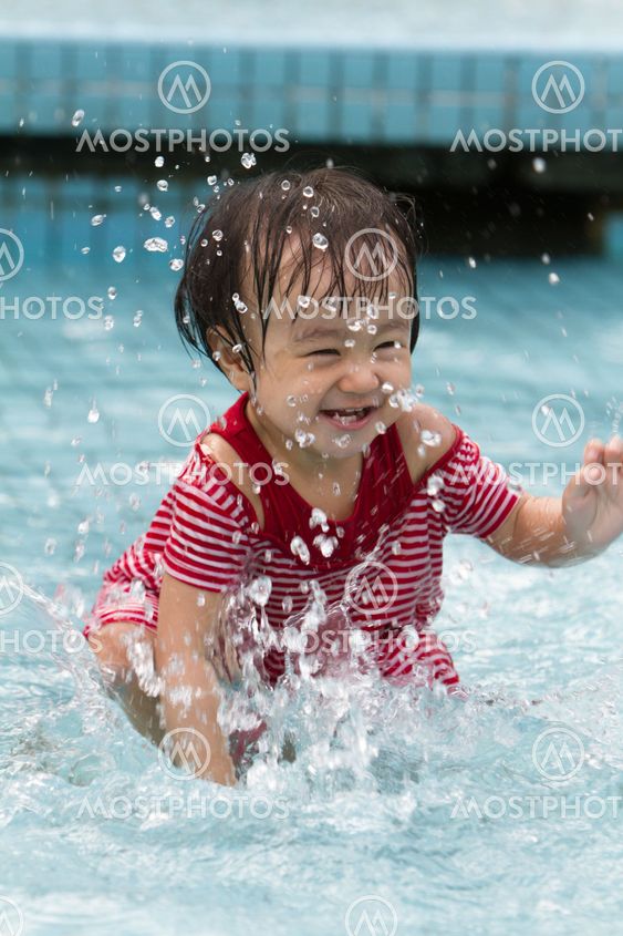 Chinese Little Girl Playing in Water