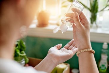 Closeup, hygiene and hands with sanitizer, cleaning and...