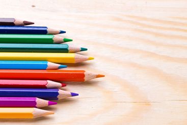 Colorful selection of pencils arranged neatly on a...