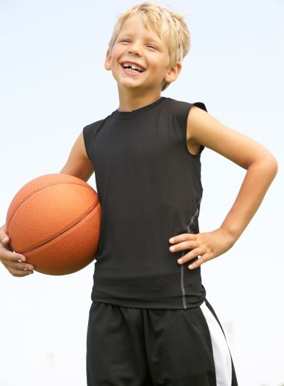Young Boy Playing American Football