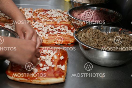 cooking pizza chicken, mushrooms and sausage