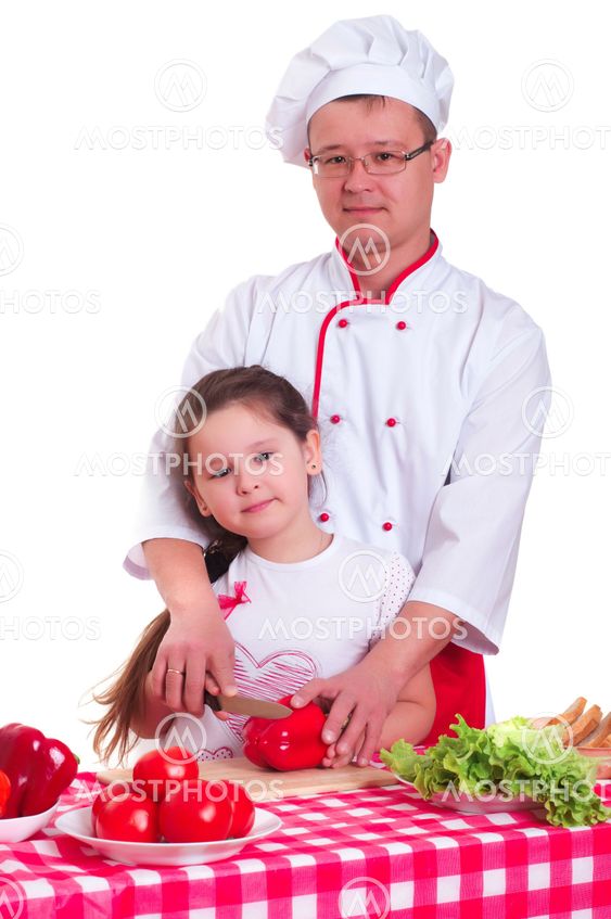 Father and daughter cooking together