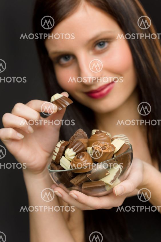 Chocolate - portrait young woman enjoy candy