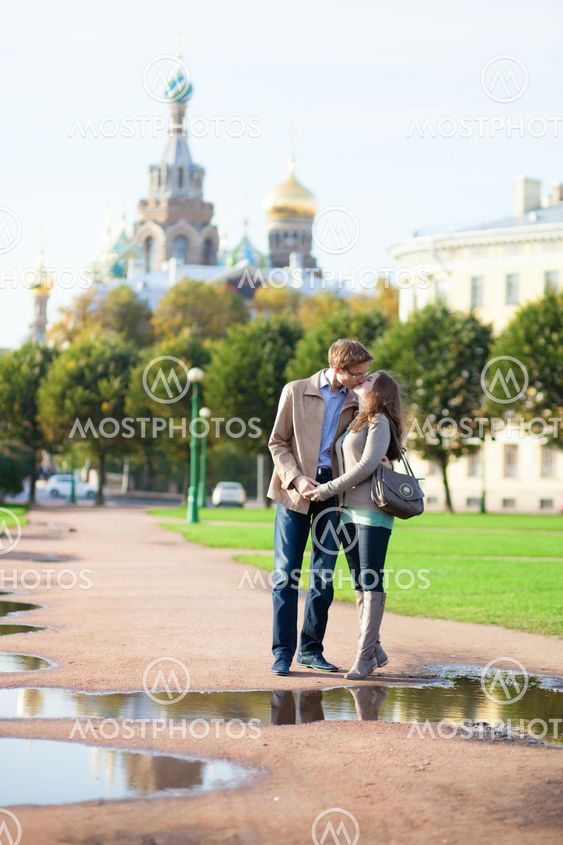 Dating couple near Church of the Savior on Blood in Saint-Petersburg, Russia