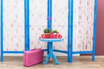 Blue wooden decorating screen with textile panels