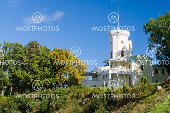 Keila-Joa manor (Schloss Fall) on hillside against blue sky