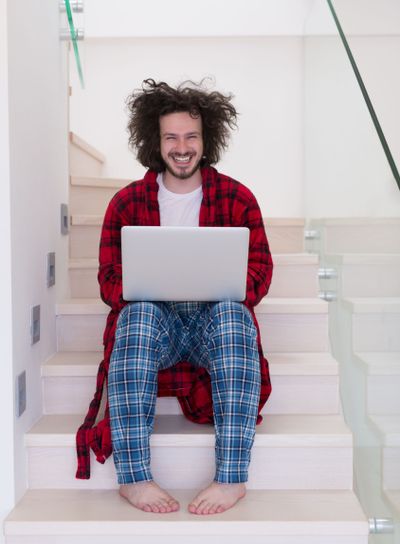 freelancer in bathrobe working from home