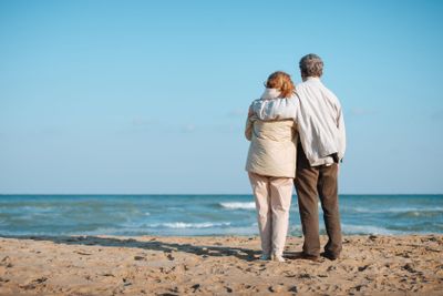 senior couple embracing on seashore