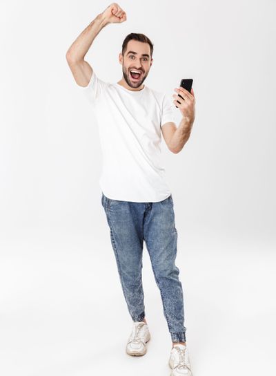 Full length of a handsome cheerful man