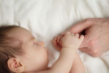 Family, childhood and innocence concept. Newborn baby...