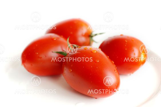 Tomatos on a white plate