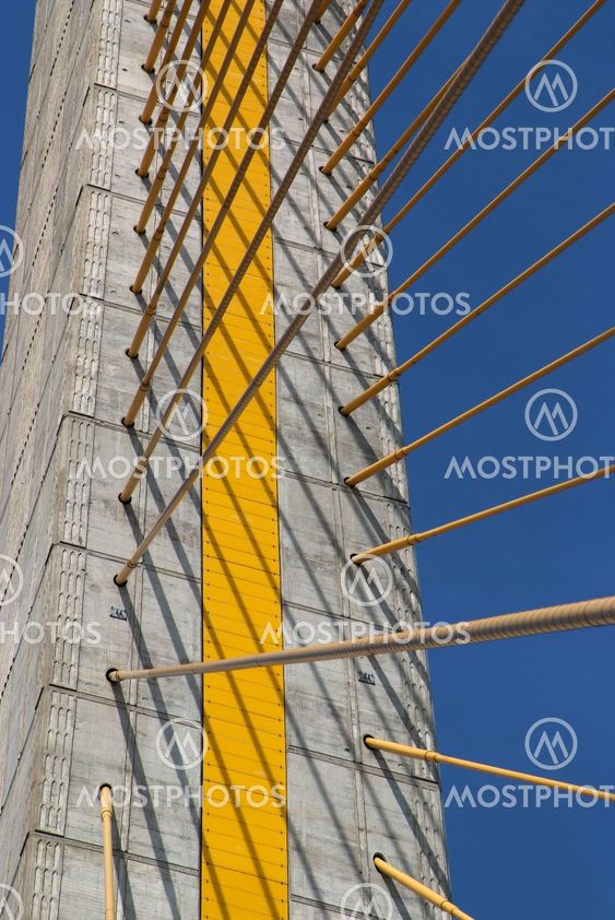 Detail of bridge construction over blue sky