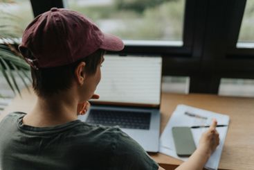 Over the shoulder view of businesswoman planning strategy...