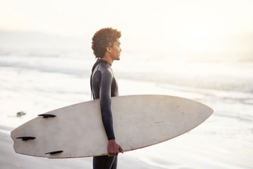 Man, surfboard or surfer at beach for fitness training,...