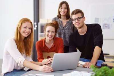 Group of happy young office co-workers