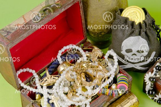 two small boxes with treasures on a light green background