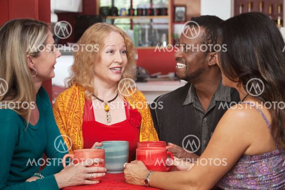 Joyful Group of Four in Cafe