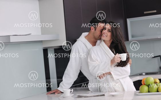 young couple have fun in modern kitchen