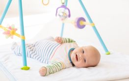 Little baby on white bed