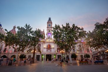 City Hall of Valencia glows at dusk, a top summer...