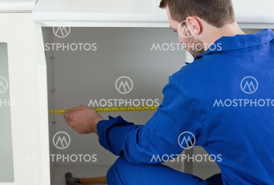 Handyman measuring something