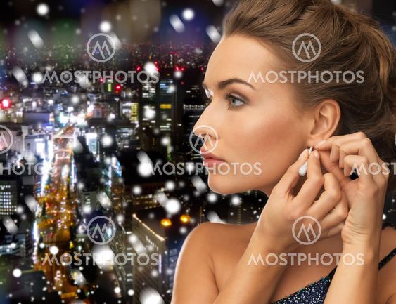 close up of woman wearing earrings