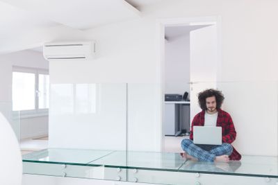 young freelancer in bathrobe working from home