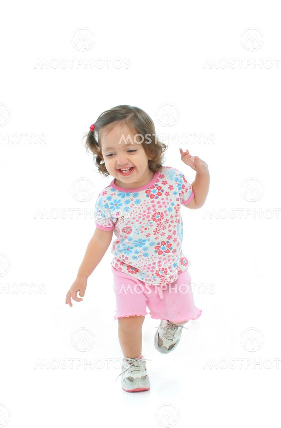 Little girl smiling and dancing