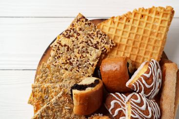Assortment of traditional desserts displayed on a wooden...