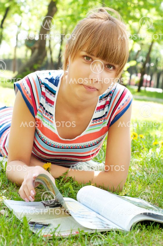 portrait of a beautiful woman in summer park