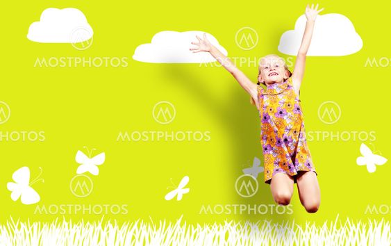 Girl jumping in a color dress
