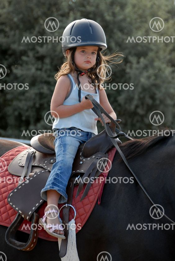 baby riding girl