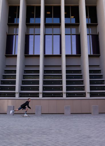 City, energy and man with skateboard, practice and...