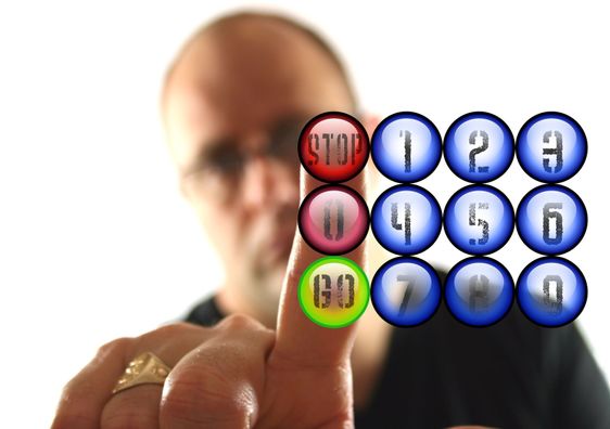 Man Pressing the Red Stop Button