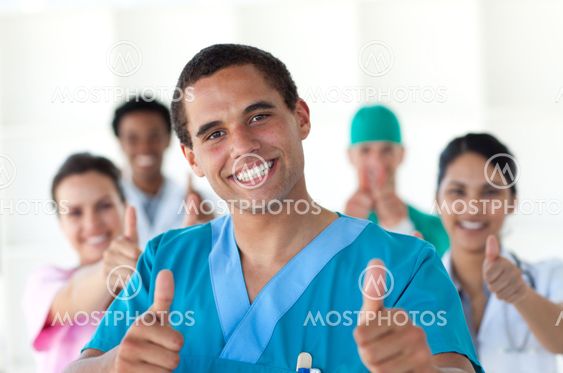 Attractive doctor with thumbs up