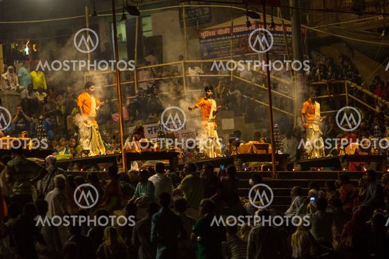 A group of priests perform Agni Pooja (Sanskrit: Worship of Fire) on Dashashwamedh Ghat - main and oldest ghat of Varanasi