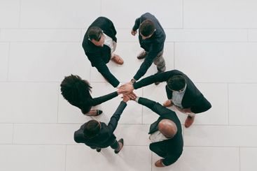 Above, teamwork and business people with hands together...