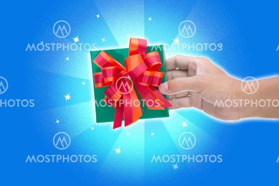 Green gift box isolated on blue background