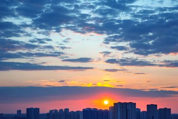 striking post-sunset sky, with a dynamic array of red...