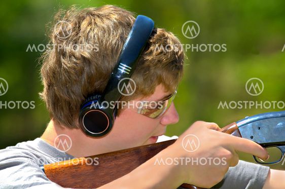 Boy Aiming Shotgun