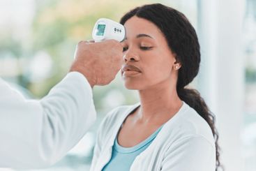 Thermometer, scan and healthcare with woman and doctor...