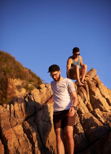 Mountain, rock climbing and men in nature, blue sky and...