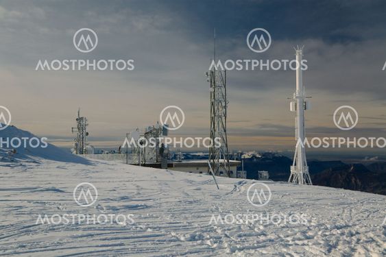Transmitter towers on a hill in winter