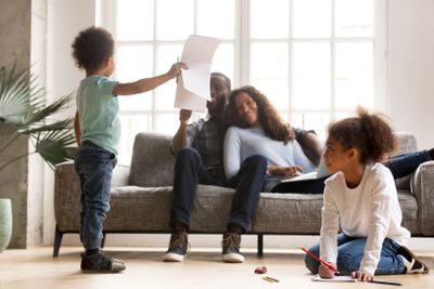 Happy African family on weekend at home