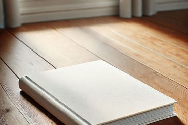 Blank Hardcover Book on Wooden Table with Natural Light