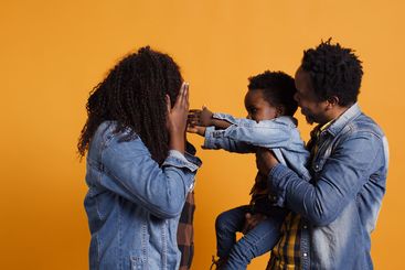 Cute mother acting silly to entertain her little son...