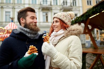happy couple walking in old town