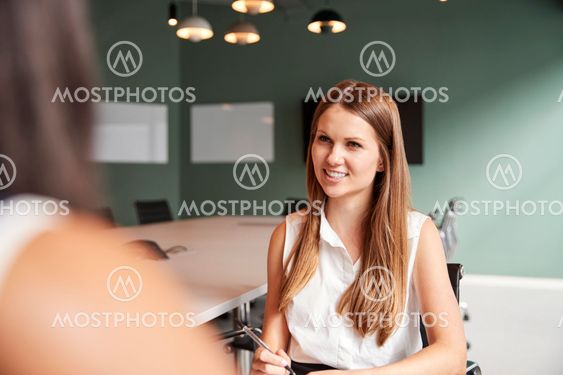Businesswoman Interviewing Female Candidate At Graduate...
