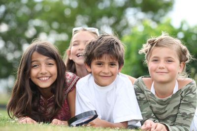 Children lying in the grass