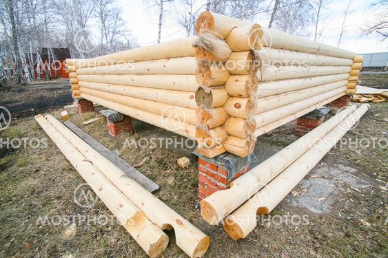 house under construction from pine logs